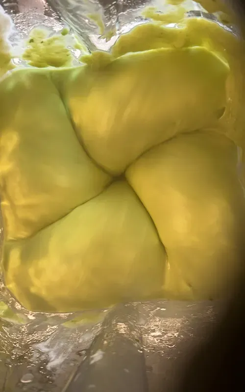 Avocado lime sauce being blended until smooth