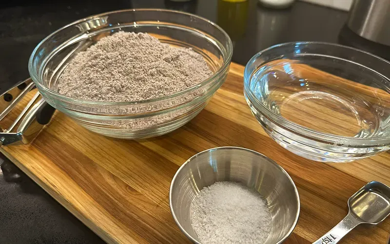 Bowls of blue corn masa flour, water and salt