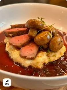 Sous vide steak and balsamic mushrooms over mashed potatoes with red wine sauce