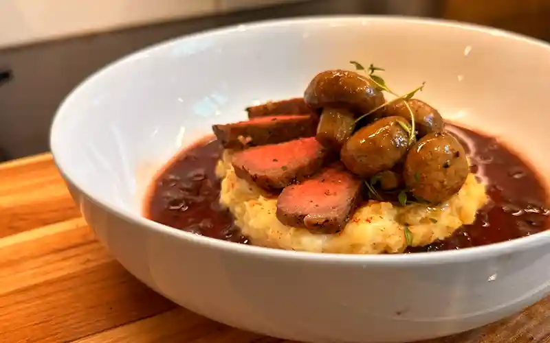 Sous Vide Steak, with Balsamic Marinated Mushrooms, Mashed Potatoes, with a Red Wine Reduction Sauce.