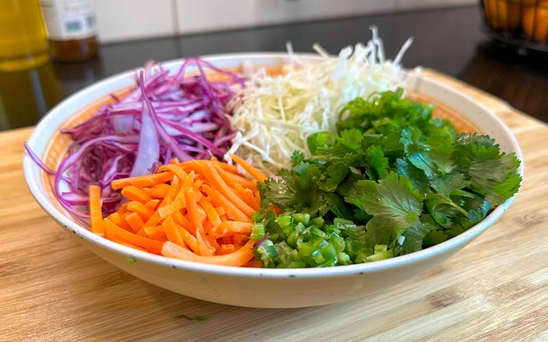 Healthy Coleslaw with a spicy jalepeno and cilantro Ingredients in a bowl