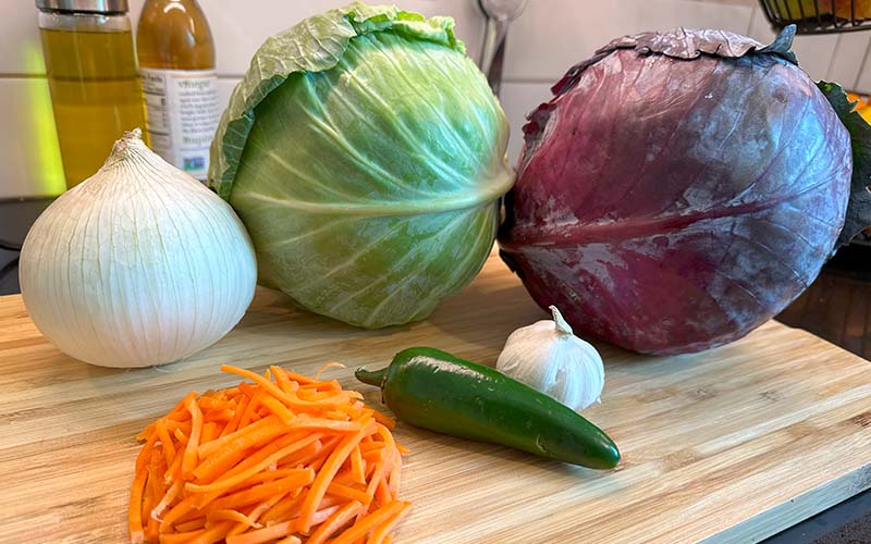 Spicy coleslaw with garlic, jalepeno, onion, and carrots