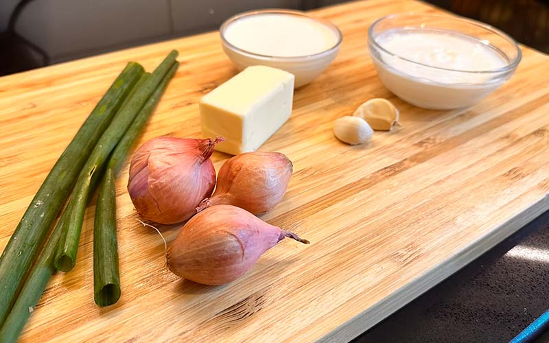 Shallots, green onions, heavy cream, sour cream, butter, and garlic.