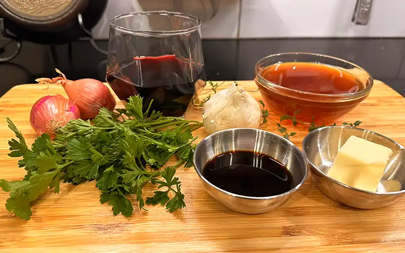 Ingredients for a quick and easy, red wine reduction.