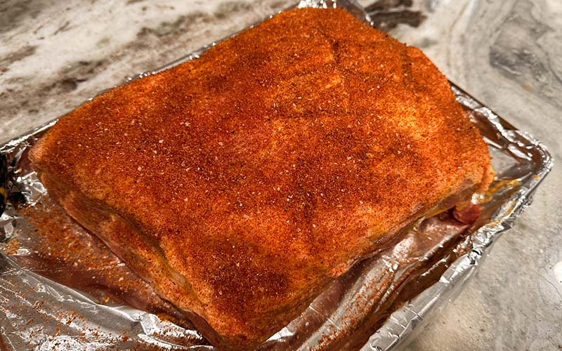 seasoning applied to pork butt.