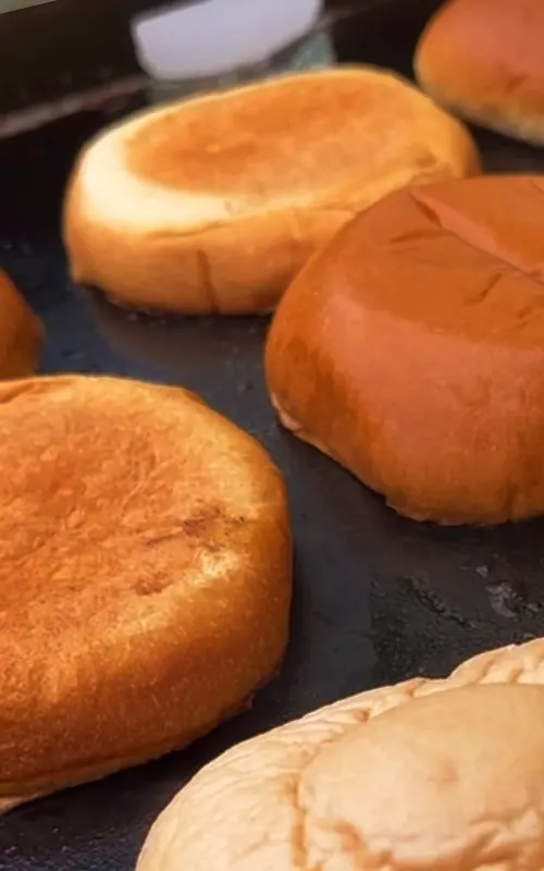 Buns toasting on the griddle