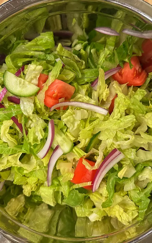 Greek Salad prepared and ready for Lemon Vinaigrette Dressing