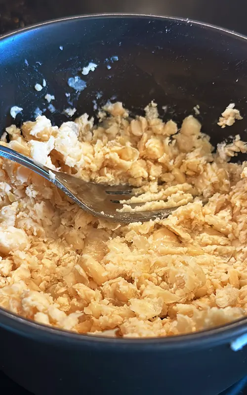 Mash the beans for crockpot white chicken chili.